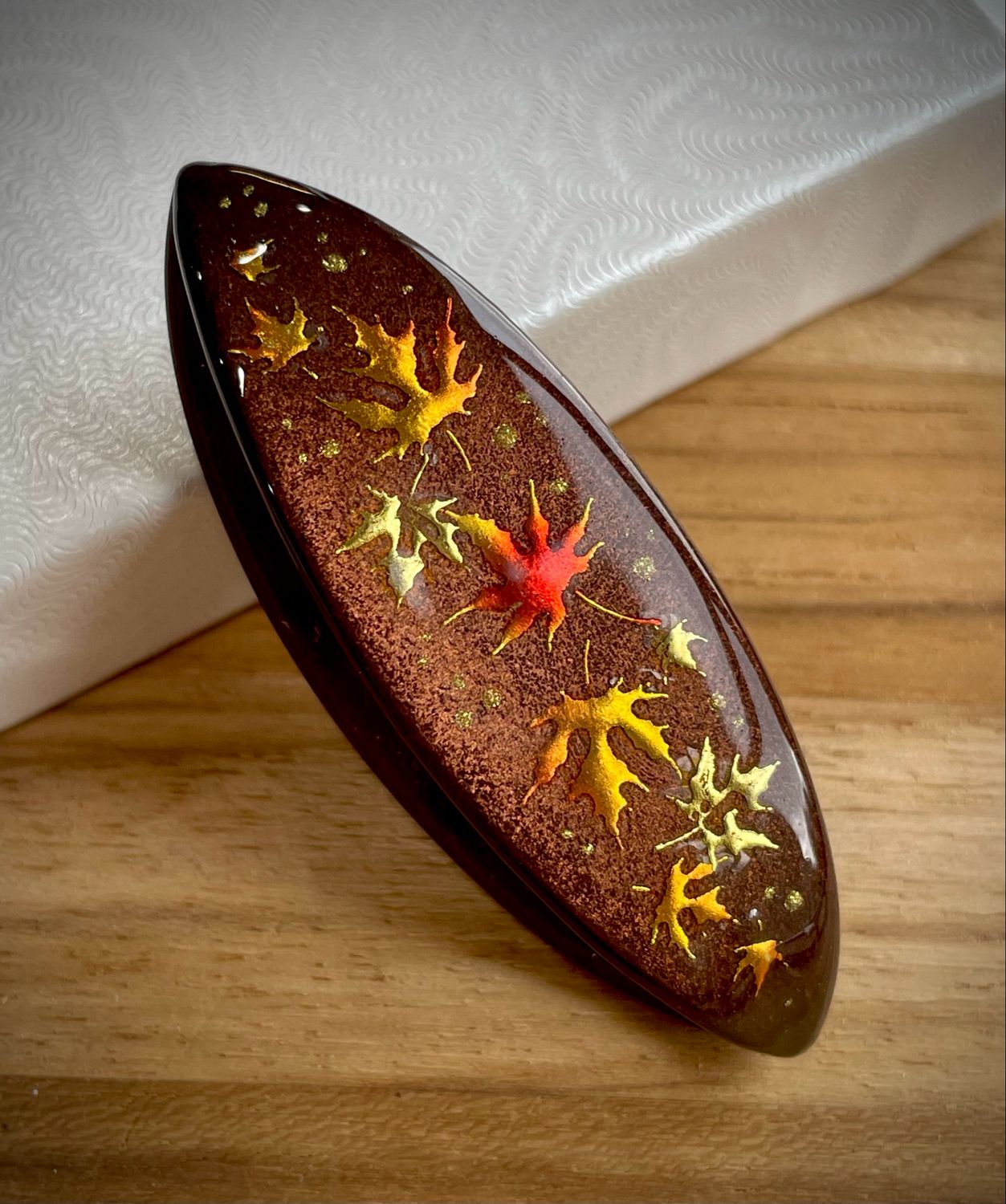 Handmade acrylic shuttle decorated on one side, Amber Showers