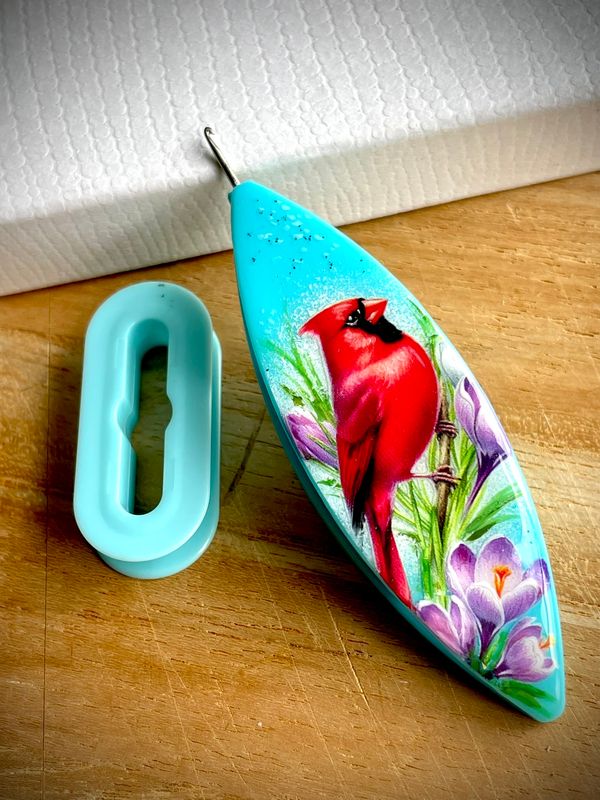 Dreamlit shuttle decorated, handcrafted design on one side, Spring Cardinal with Crocuses