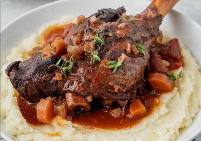 Heavenly lamb shank served over creamy mashed potatoes, finished with a delicate mirepoix–tomato herb sauce.