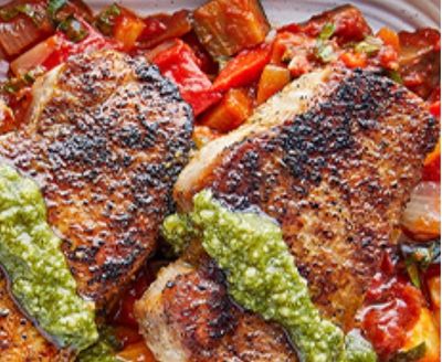 Grilled boneless pork loin served over a rich ratatouille of eggplant, zucchini, tricolor peppers, red onion, and tomato, finished with a vibrant salsa verde.