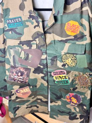 PATCHWORKZ: Quarter length camo jacket  with motivational saying and colorful patches