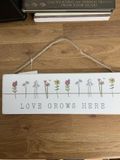 Love Grows Here Sign