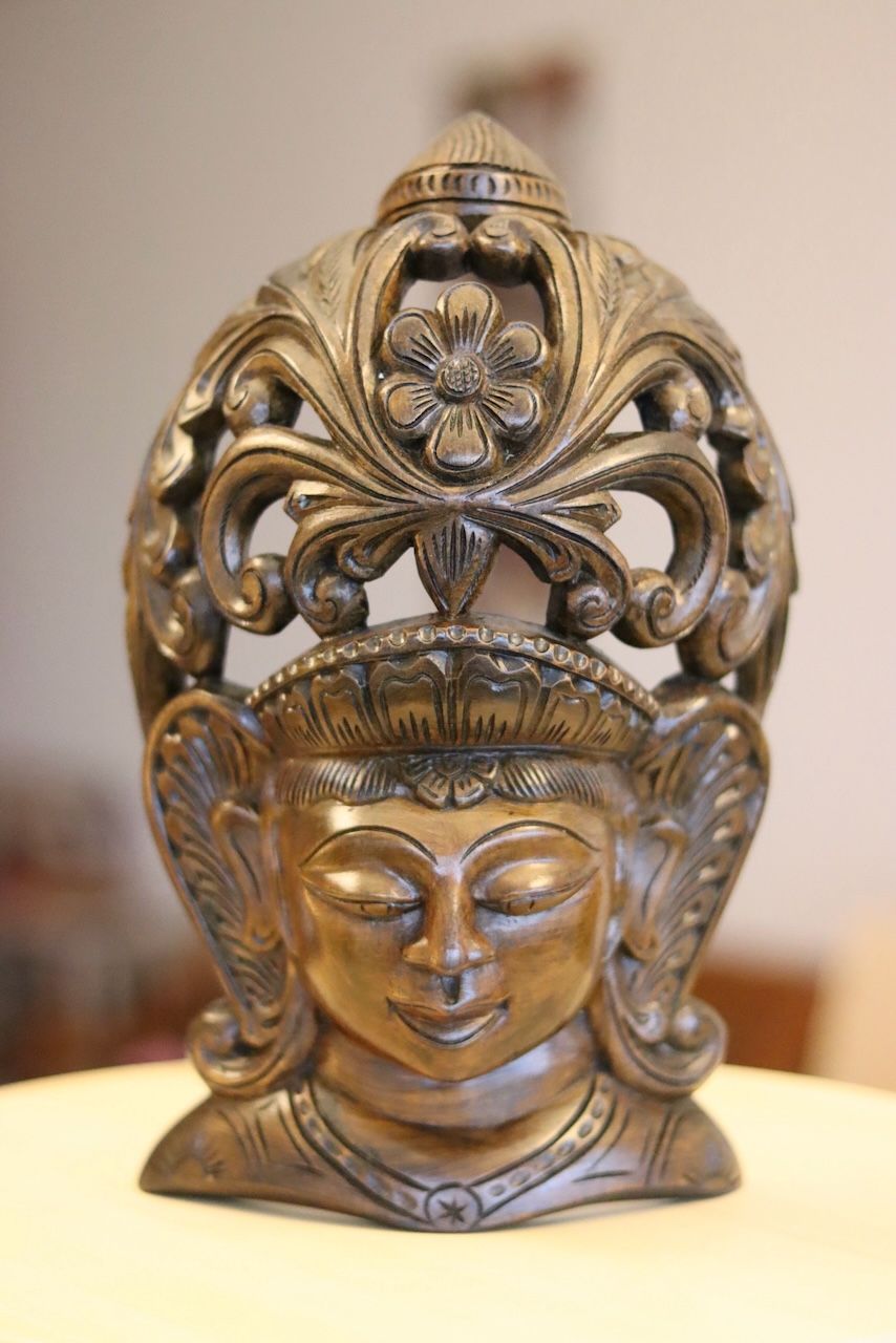 Handmade wooden Queen Face mask, skillfully carved from Kanduru wood, adding a touch of cultural elegance to any space.