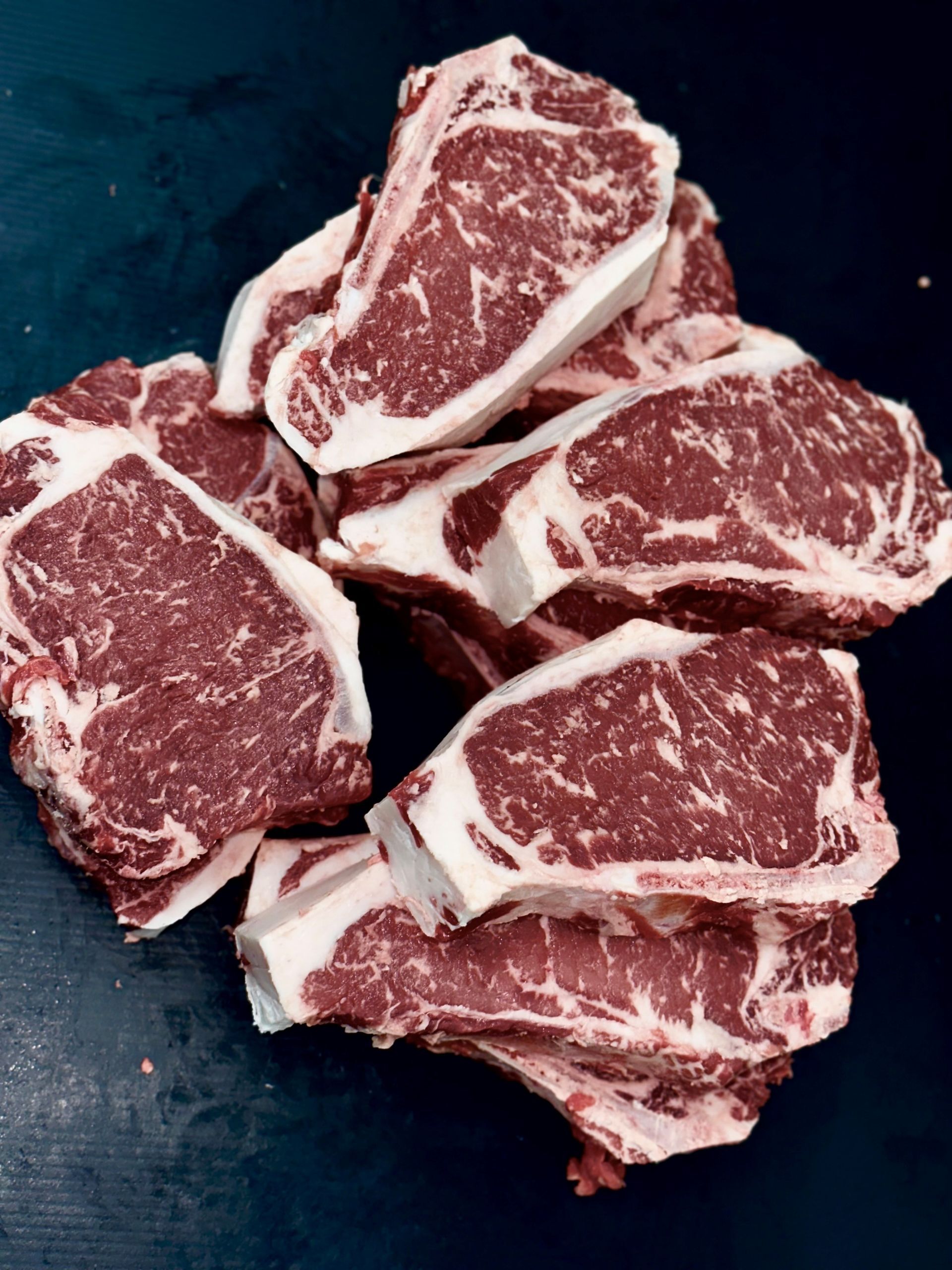 The Cowboy Prime Sampler – premium dry-aged steak bundle with ribeye, filet mignon, sirloin, sausages, and roast.