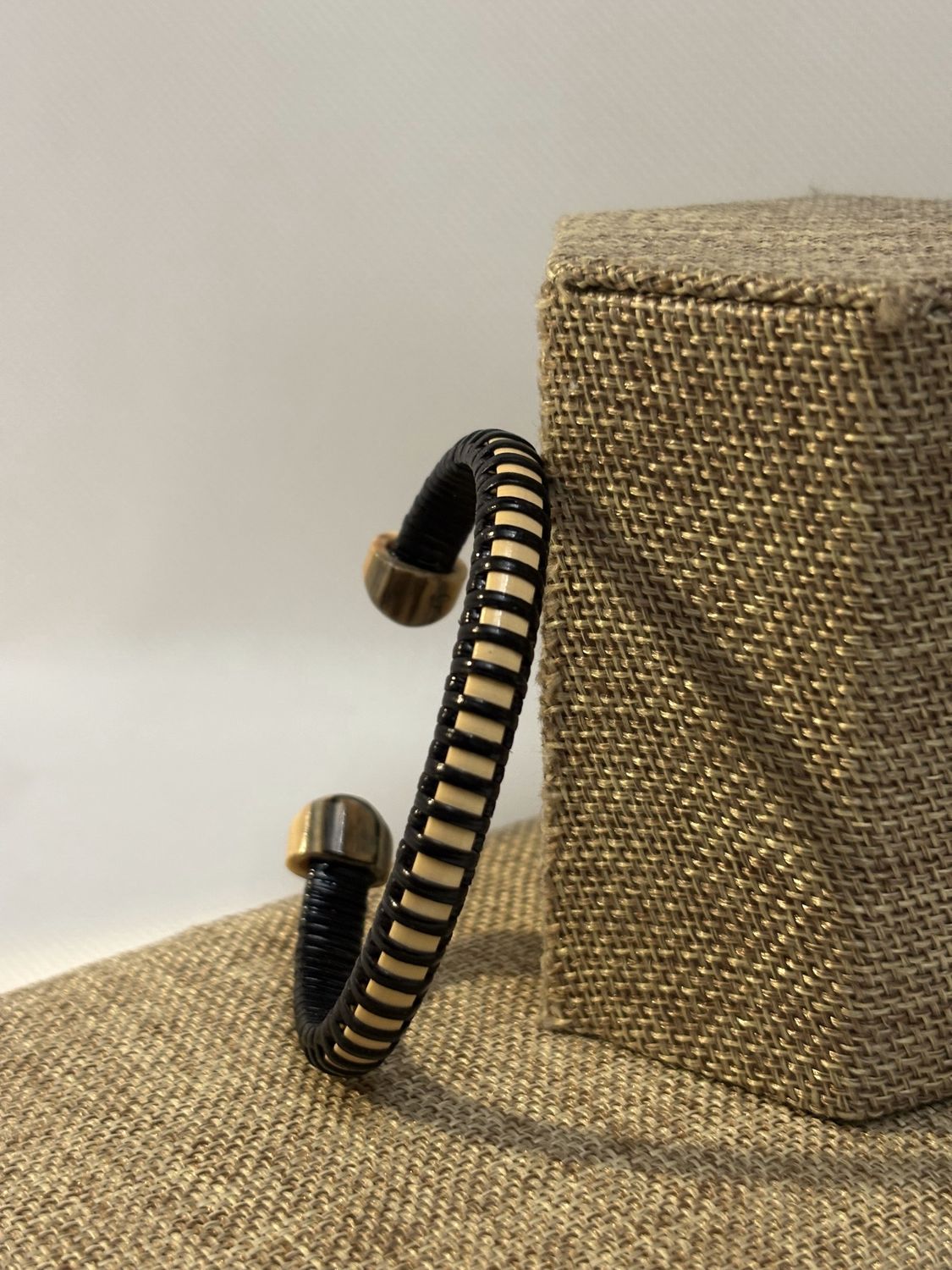 Nantucket Lightship Basket Cuff Bracelet woven using Black Cane with Fossilized Wooly Mammoth Ivory End Caps - by Caitlin Parsons