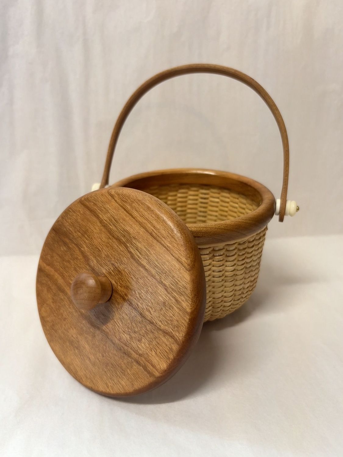 Nantucket Lighthsip Basket 4 1/2" Round Lidded Basket w/ Cherry Accents and Carved Bone knobs