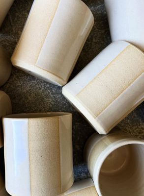 Twelve Gray Clay Tumblers