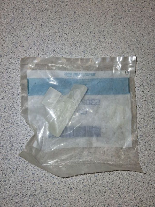 5303261023 - WASHER DOOR CATCH - NLA 5303261023 - WASHER DOOR CATCH - NLA