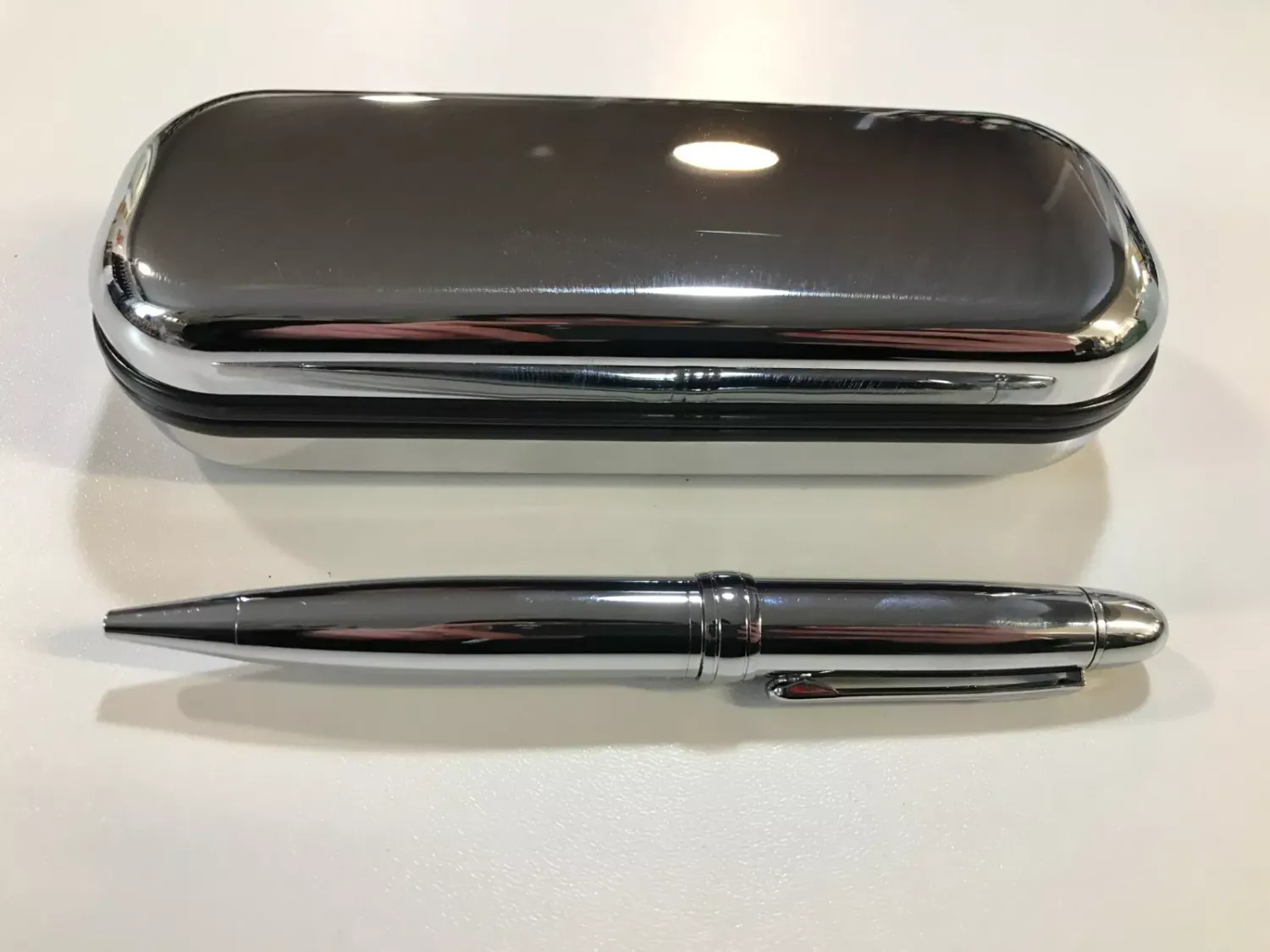Silver ball point pen in gift box.
