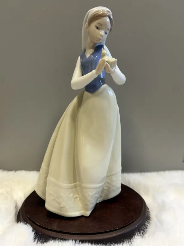 Nao Lladro, Feathered Friend, Lady Holding Chick, No. 1264 / 1996, Porcelain