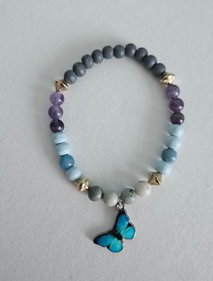 Blauwe transformerende vlinderarmband