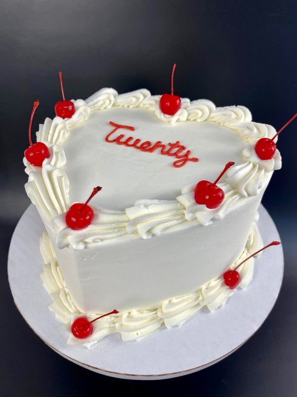 White Heart Cake With Cherry Accents