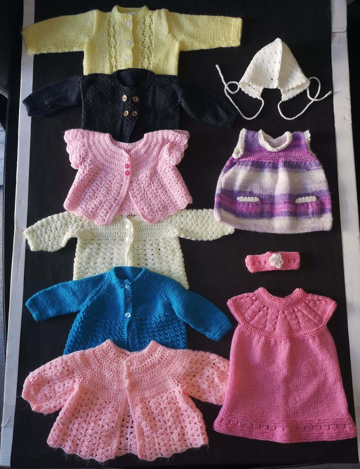 Bundle of hand knit clothes