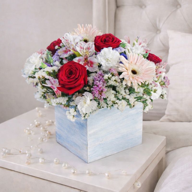 Caja con rosas y gerberas