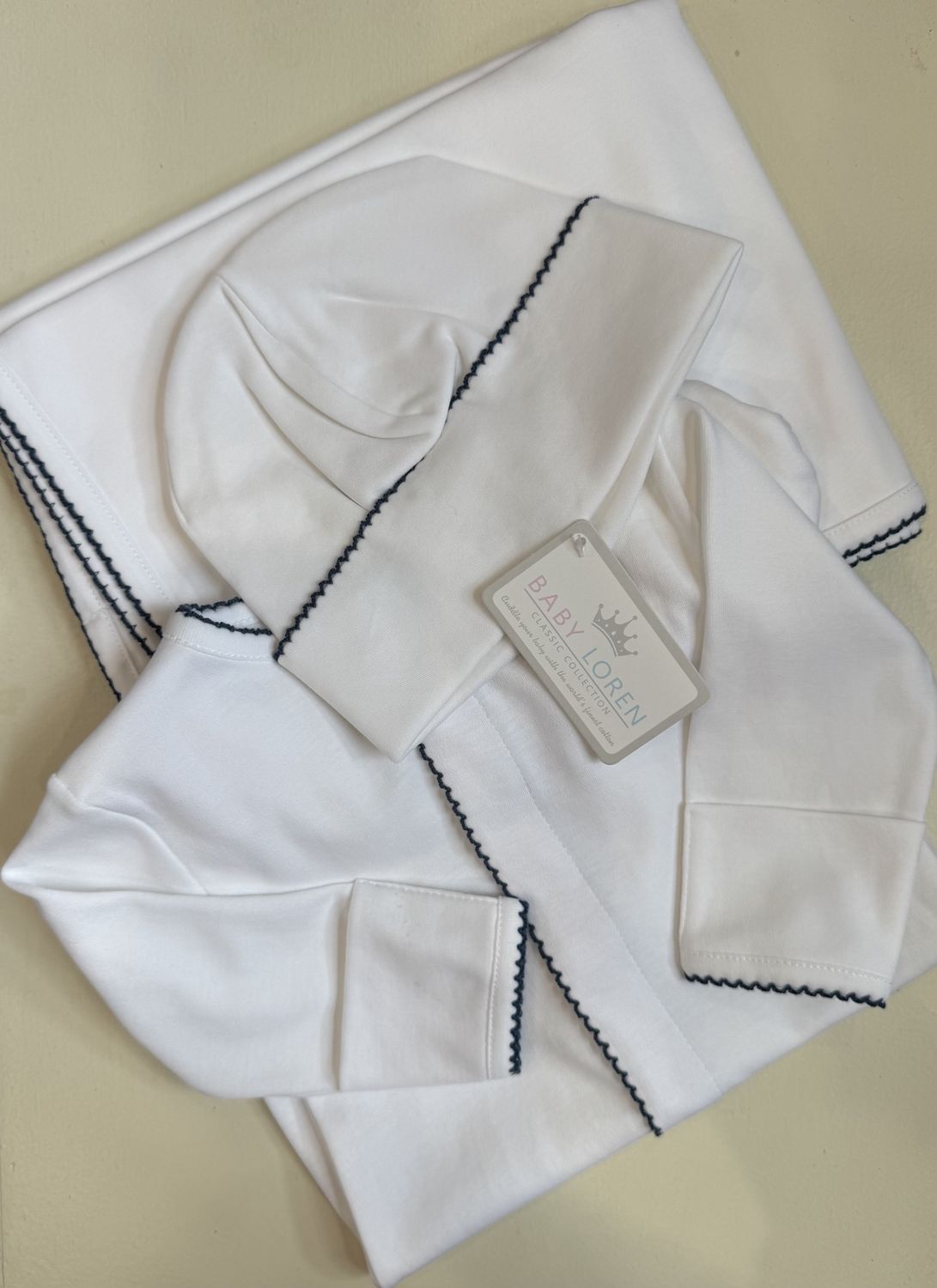 WHITE PIMA RECEIVING BLANKET W/ NAVY BLUE TRIM