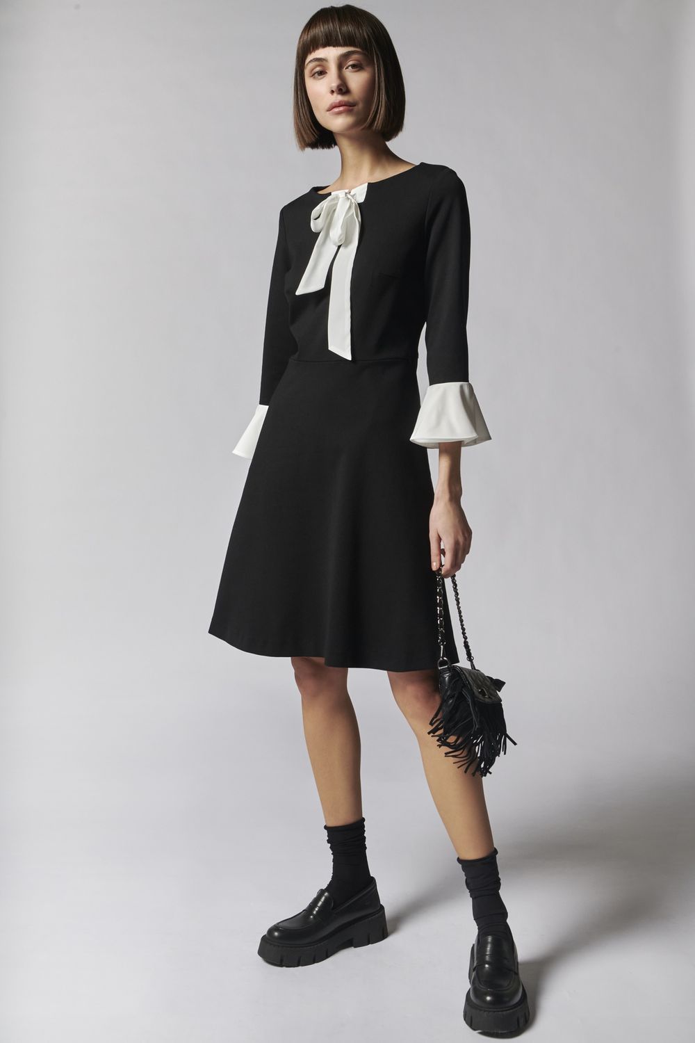 Black dress with pussy bow and cuff detail