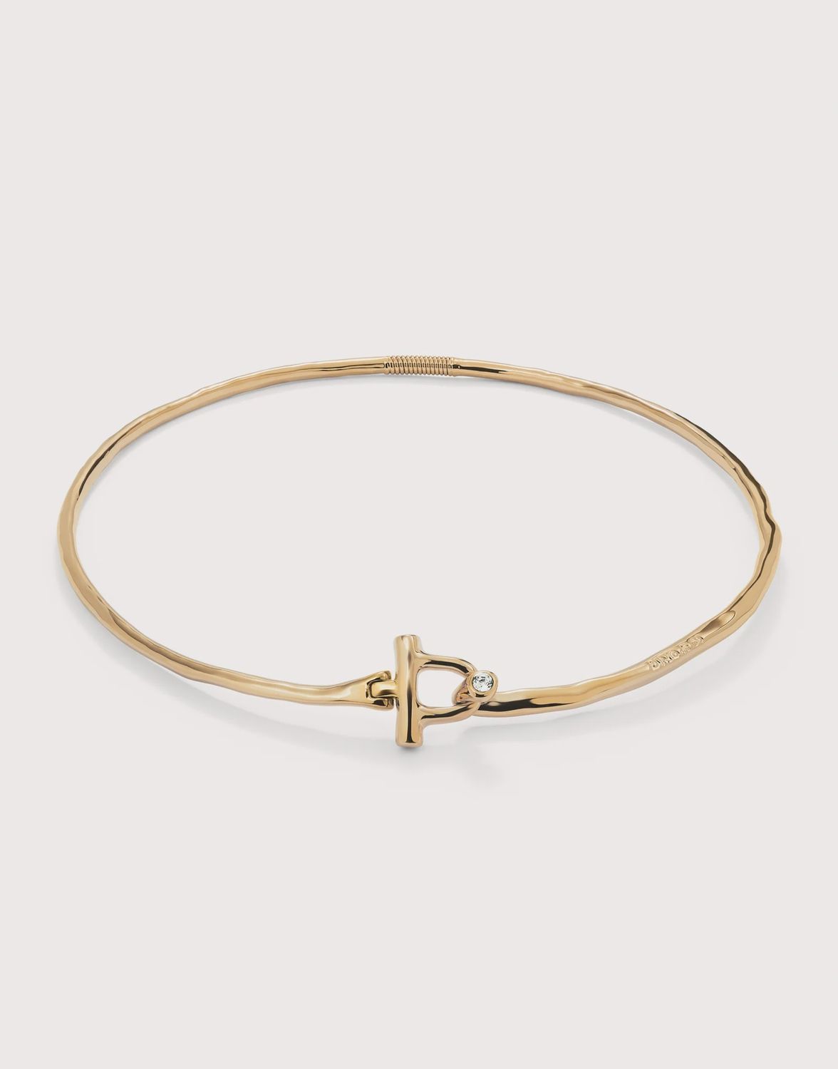 Rigid necklace in gold with white topaz