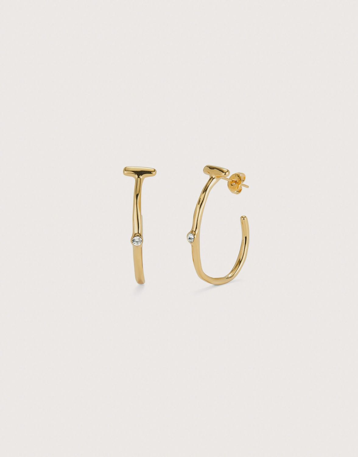 Hoop earrings in gold with white topaz