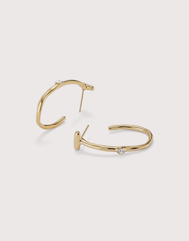 Hoop earrings in gold with white topaz