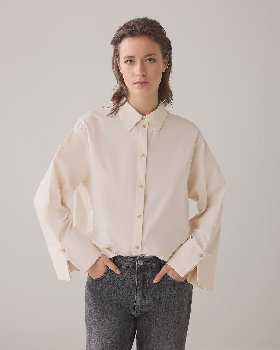 Cream blouse with wide cuffs
