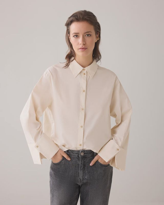 Cream blouse with wide cuffs