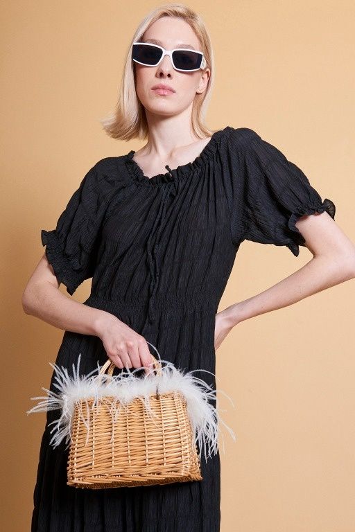 White Hand made salines bag with feather trim