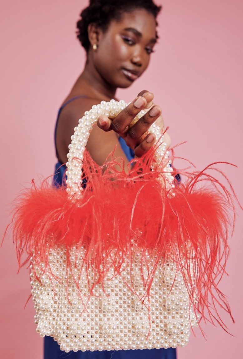 Red faux Pearl bag with feather trim