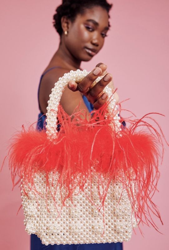 Red faux Pearl bag with feather trim