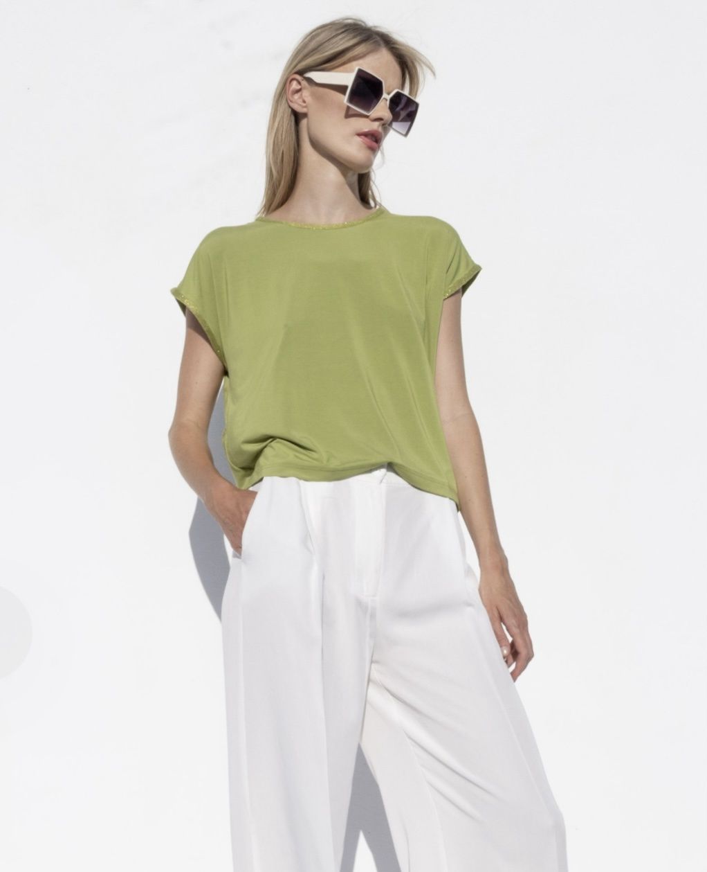 Bright green jersey tank top with knitted details