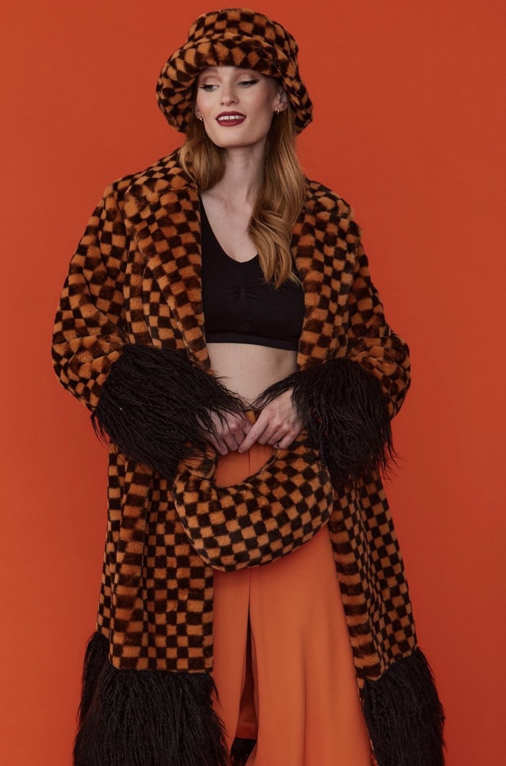Orange and black faux fur check coat