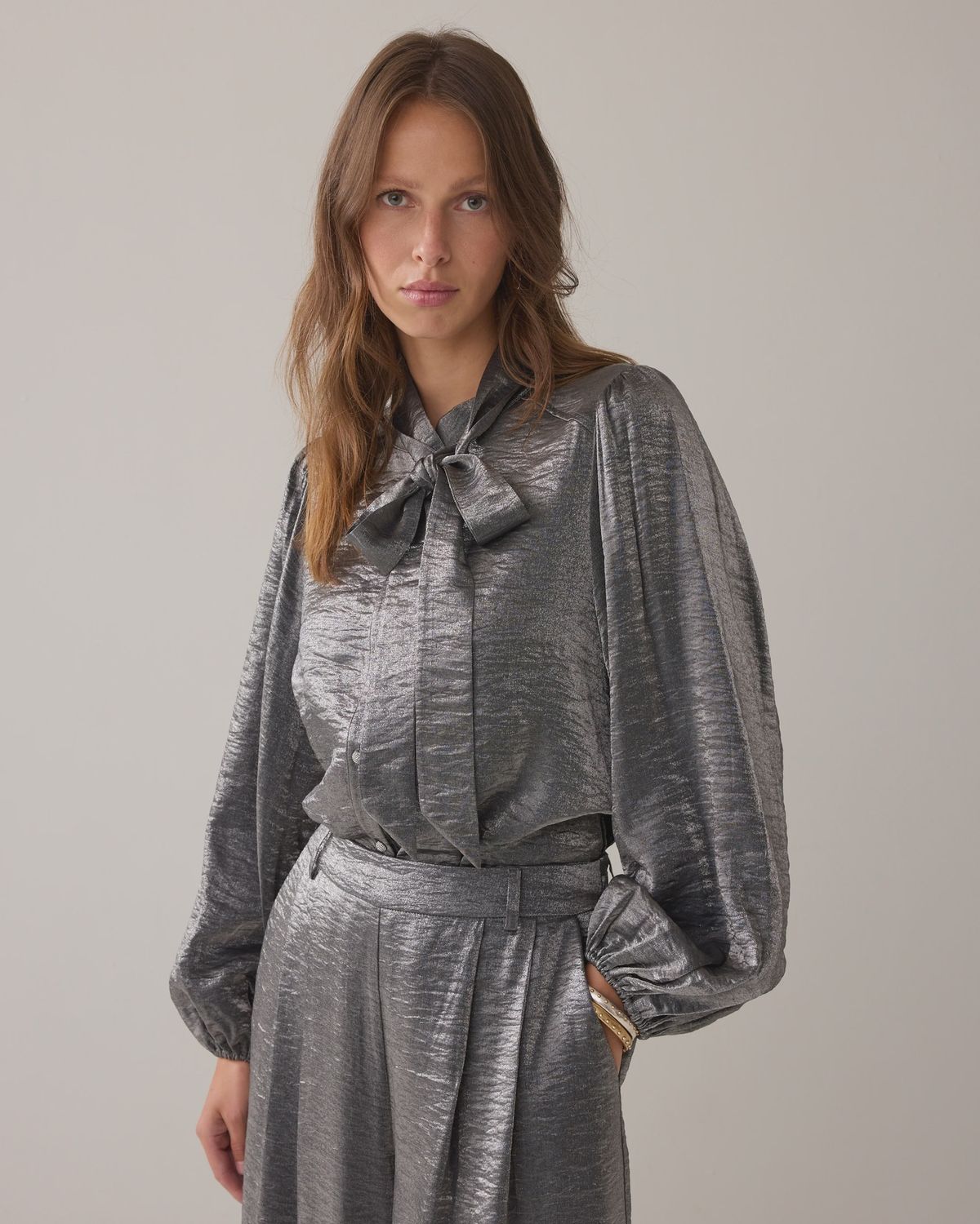 Metallic silver blouse with bow detail