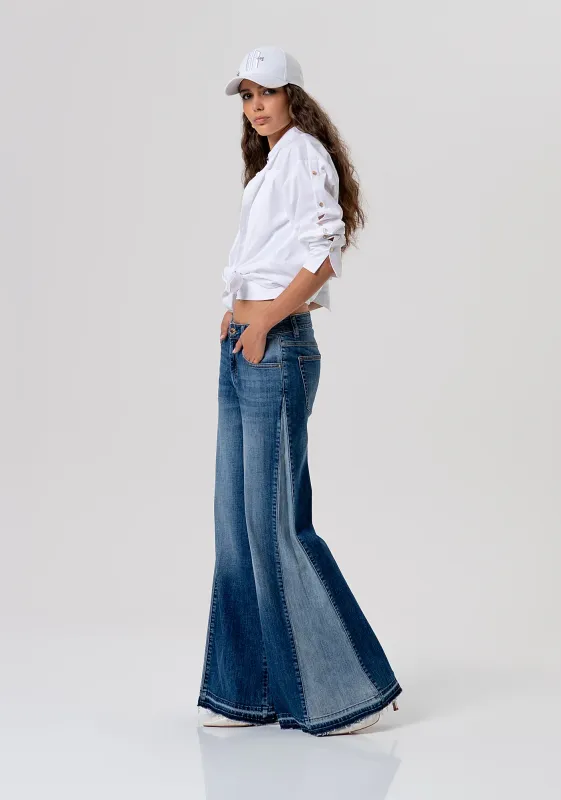 Flare jeans with contrast panel in mid wash blue denim