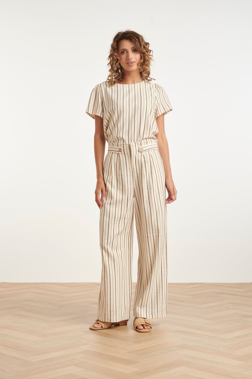 Wide leg trousers in cream, with brown pinstripe