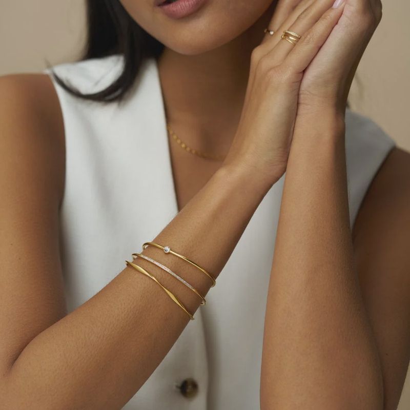 Crystal and wave stacking bracelets gold