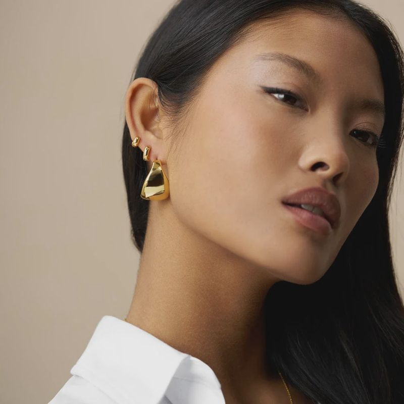Statement taper hoop earrings gold