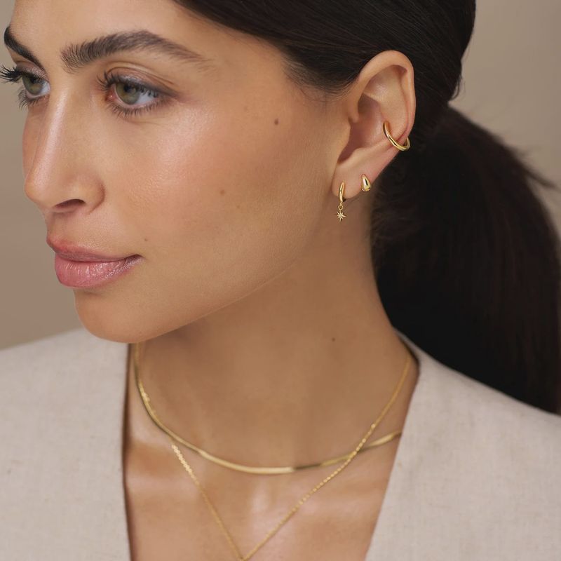 Starburst pave huggie hoops gold