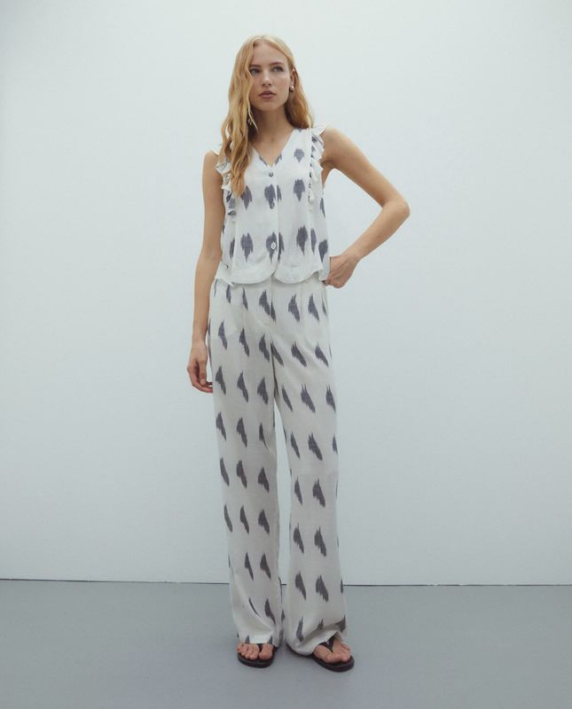 Cream trousers with geometric print