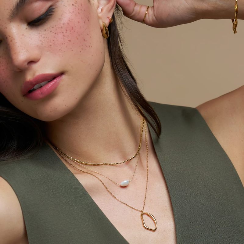 Organic oval &amp; pearl 3-row necklace gold