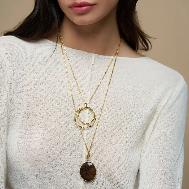 Statement ribbon interlocking pendant necklace gold