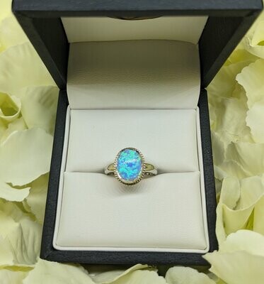 9ct White Gold Synthetic Blue Opal Solitaire Twist Ring