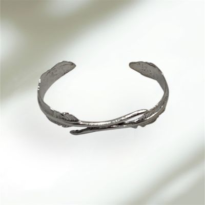 Elevate your style with our stainless steel feather-shaped bracelet