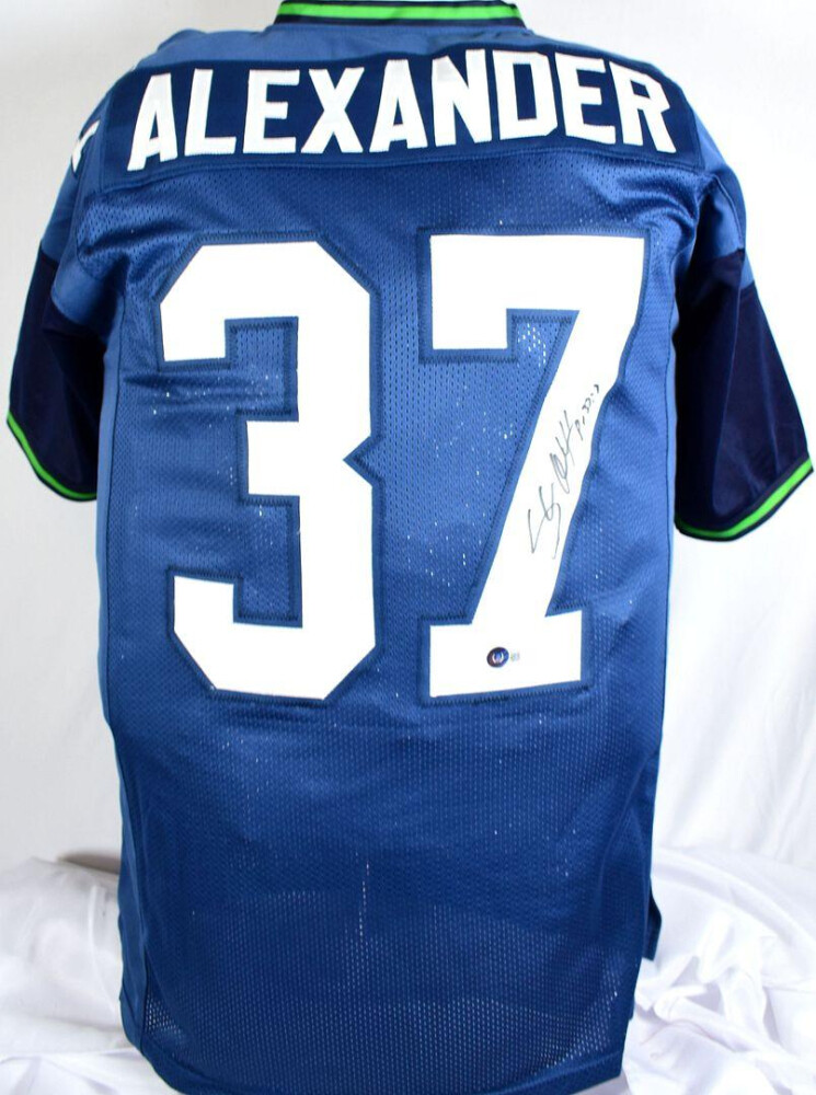 Shaun Alexander Signed Jersey (Beckett) and Shaun Alexander Signed Seahawks Flash Alternate Speed Mini Helmet (Beckett)