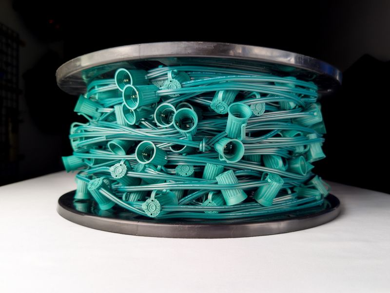 C9 Green Socket Cord Spool - 500 feet of durable cord for professional outdoor lighting installations.