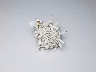 Mini Lights Warm White with 4-inch spacing, 70 lights on white wire for professional residential and commercial decorative installations.