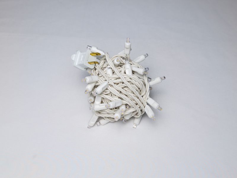 Mini Lights Warm White with 4-inch spacing, 70 lights on white wire for professional residential and commercial decorative installations.