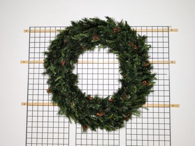 Warm White Noble Wreath – pre-lit with warm white LED lights, durable for indoor and outdoor use.