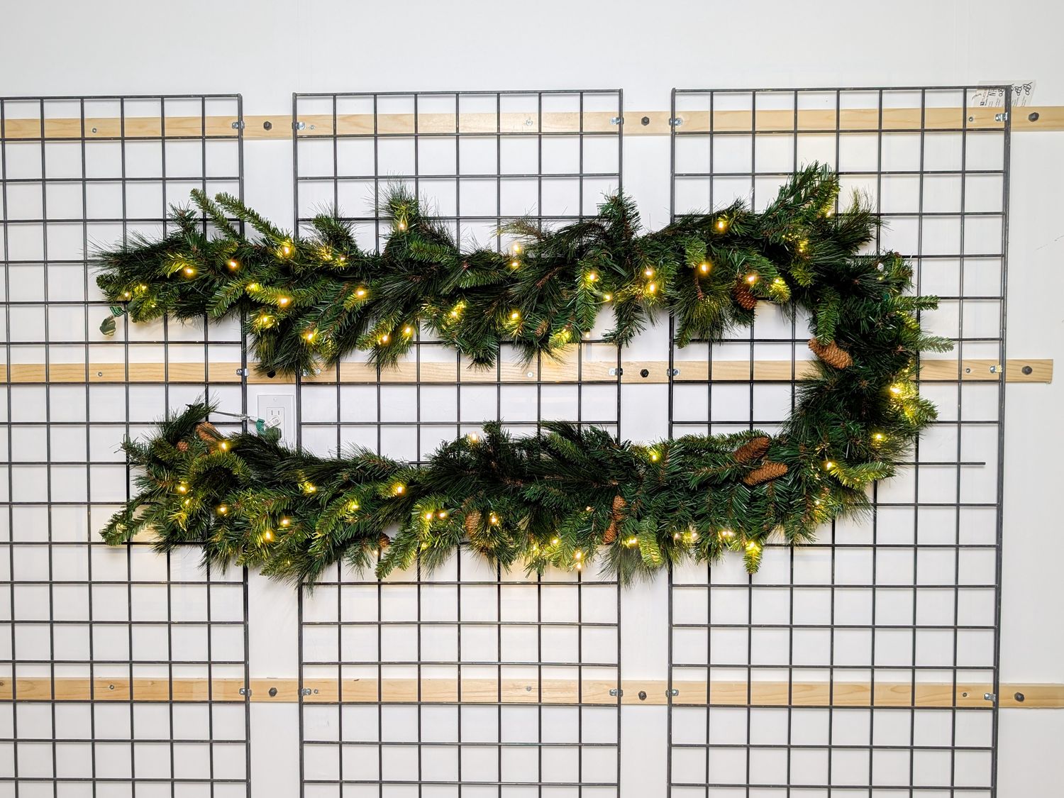 Warm White Noble Garland 9’x14” – pre-lit with warm white LED lights, durable for indoor and outdoor use.