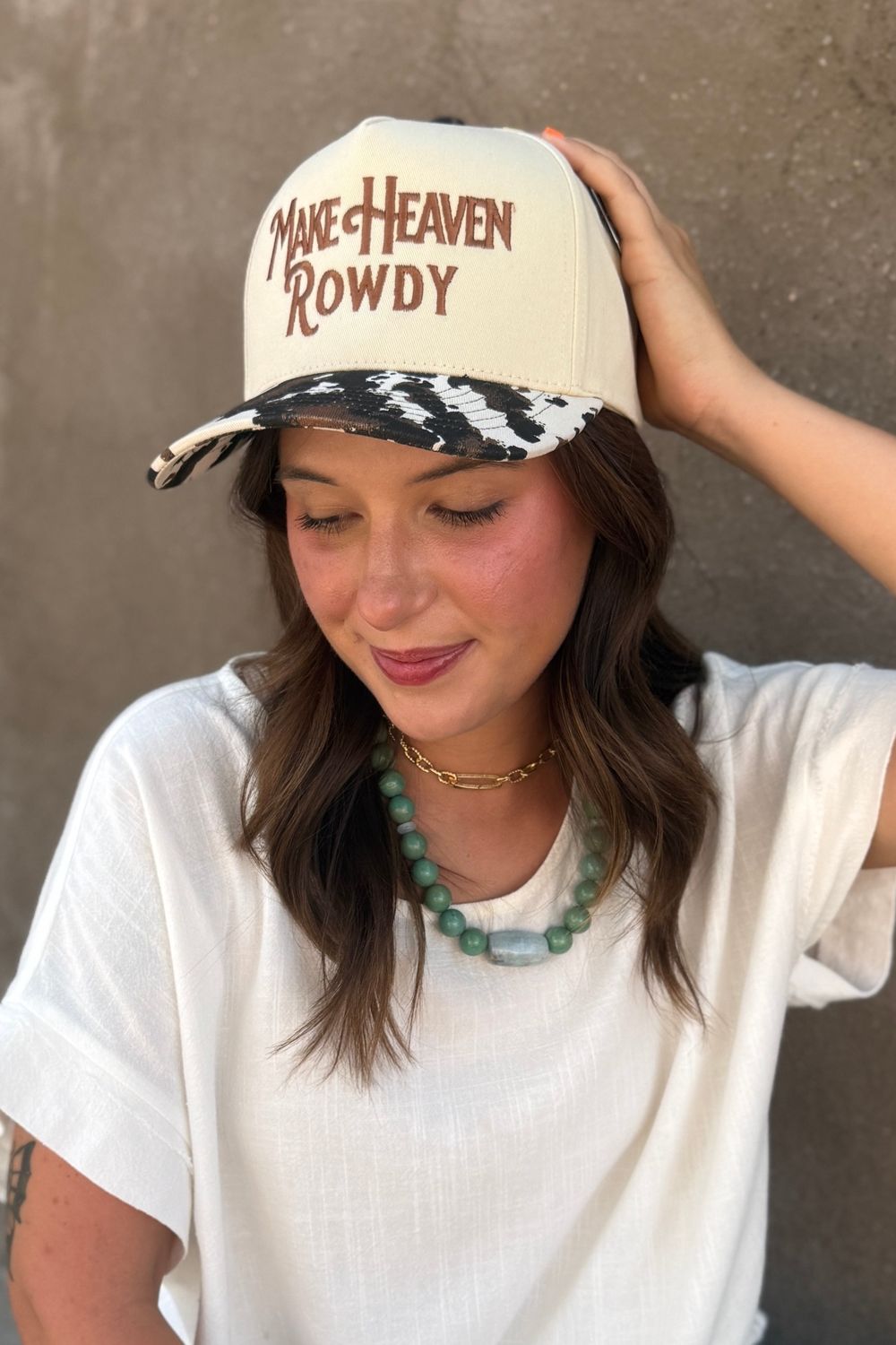 Make Heaven Rowdy Cow Print Trucker Hat