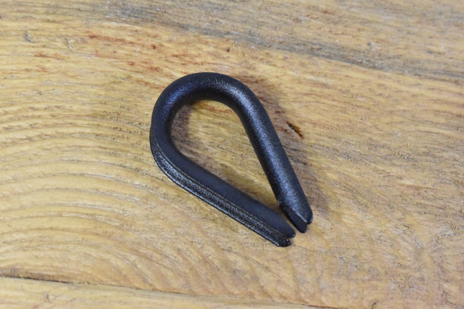 1/4 inch wire rope thimble made of steel with custom powder coated finish, ideal for securing wire loops.