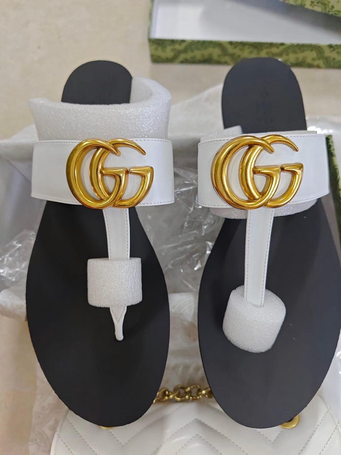 White Gucci Slides with Gold Letters